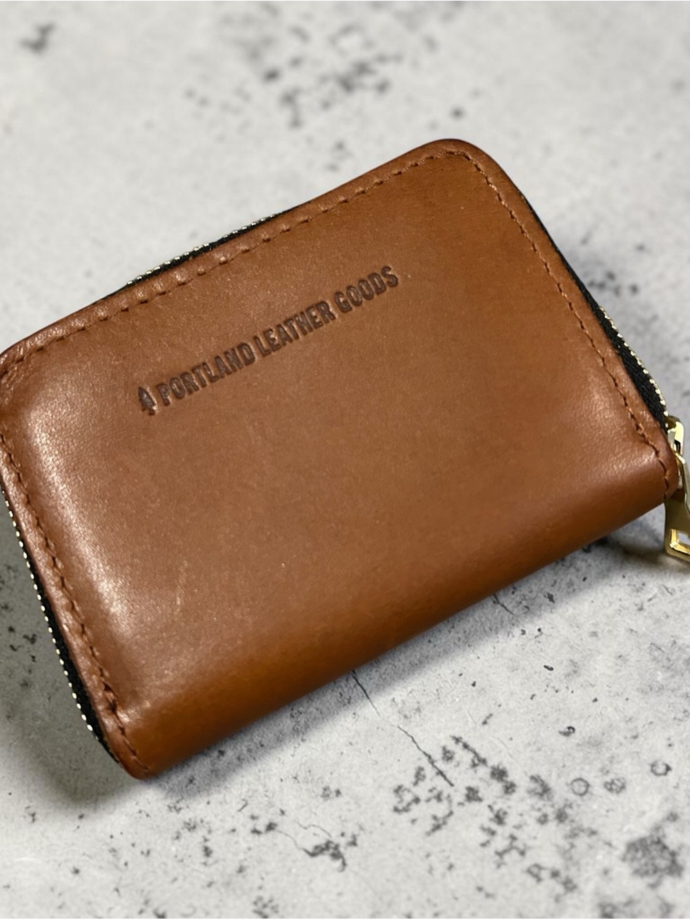A Portland Leather Goods Tan Leather Zip Wallet
